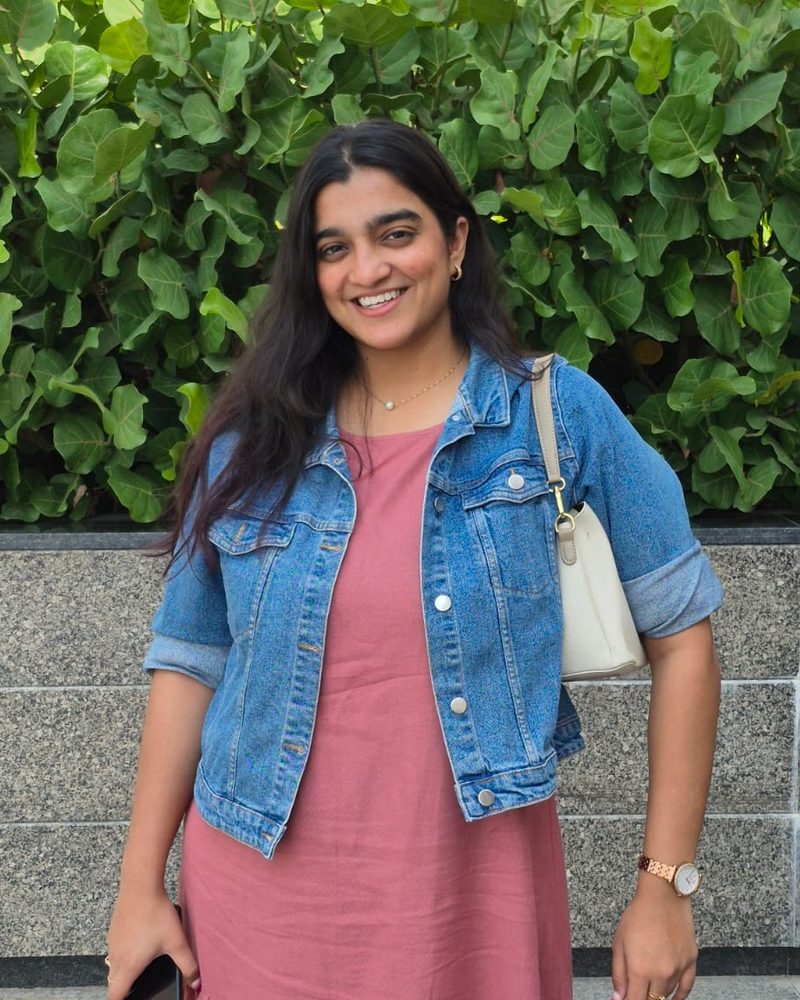 Muskan Shah smiling in a denim jacket